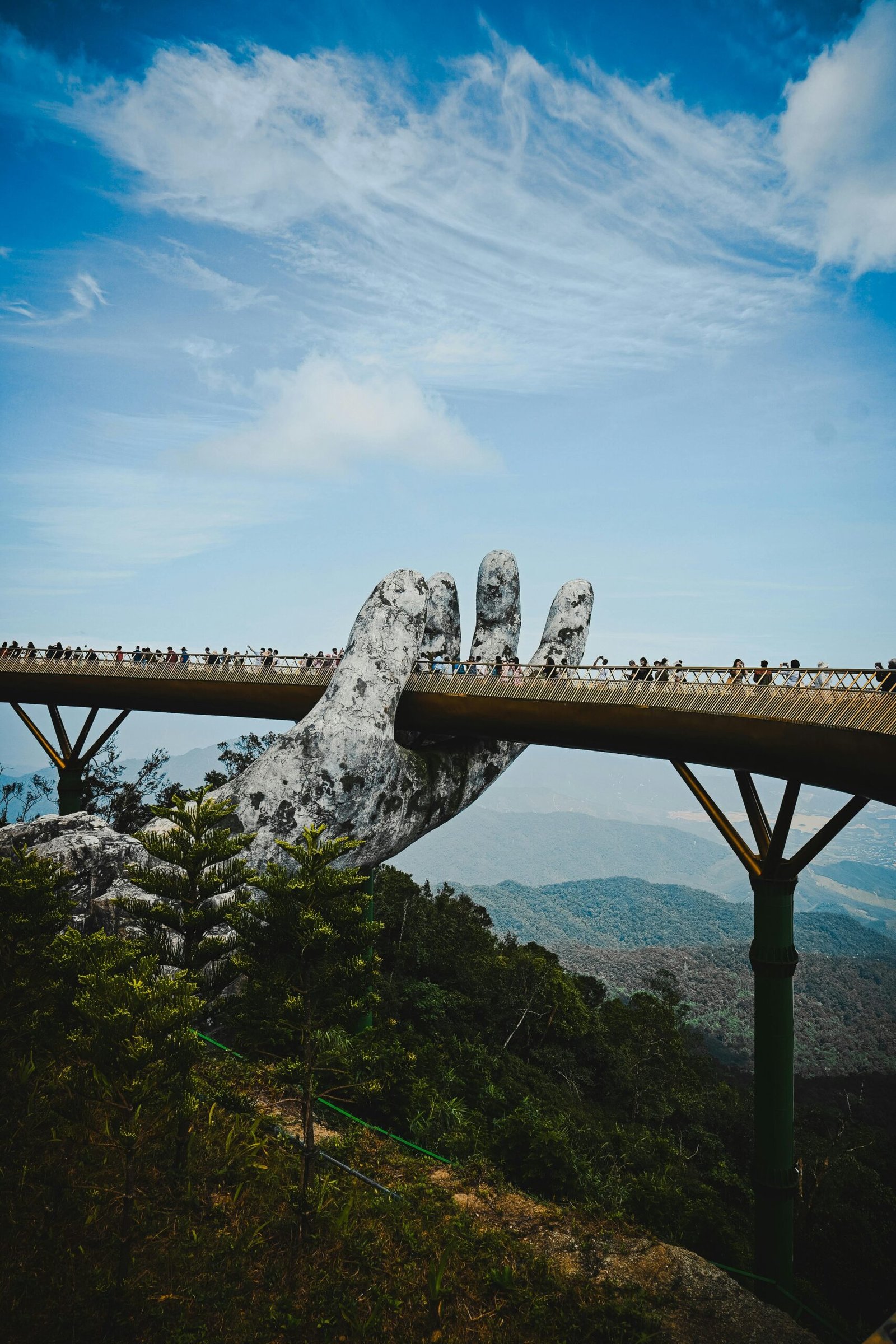 The iconic Golden Bridge held by giant hands at Ba Na Hills, Da Nang.